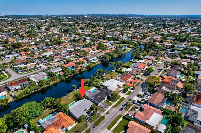 bird's eye view with a water view and a residential view