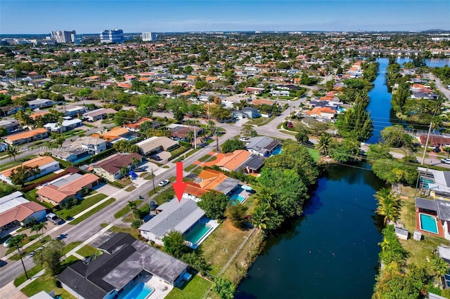 birds eye view of property featuring a water view and a residential view