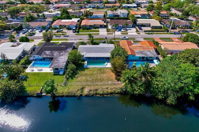 aerial view with a residential view and a water view