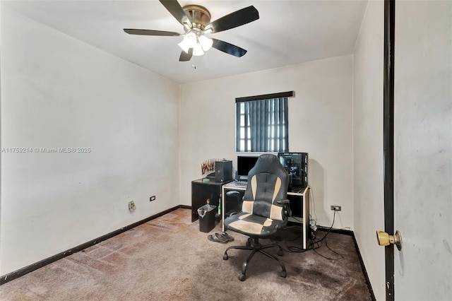 carpeted office space with baseboards and ceiling fan