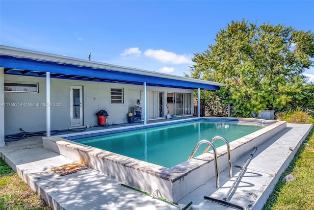 pool featuring a patio area