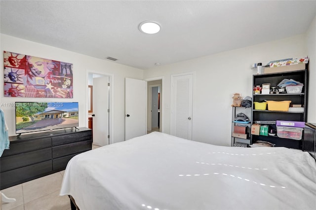 tiled bedroom featuring visible vents