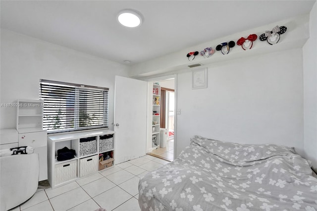 tiled bedroom with visible vents