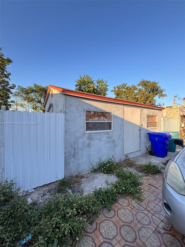 view of outdoor structure with fence