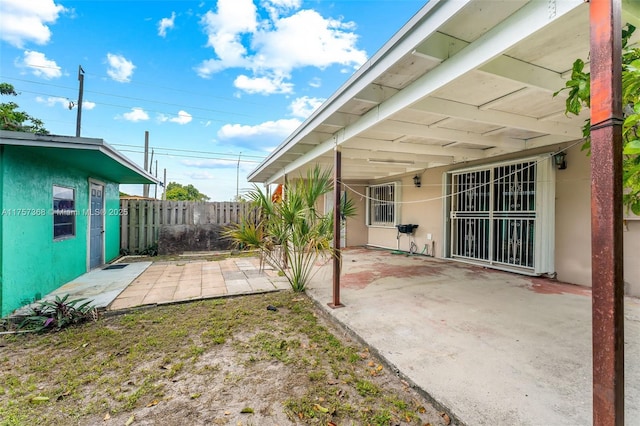 view of patio featuring fence