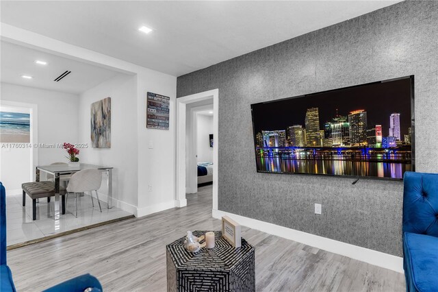 231 NW 44th St, Miami, FL 33127 - living area featuring wood finished floors, baseboards, and recessed lighting