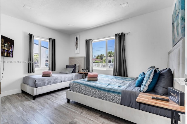 231 NW 44th St, Miami, FL 33127 - bedroom featuring wood finished floors and baseboards