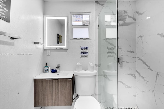 231 NW 44th St, Miami, FL 33127 - bathroom featuring a marble finish shower, toilet, and vanity