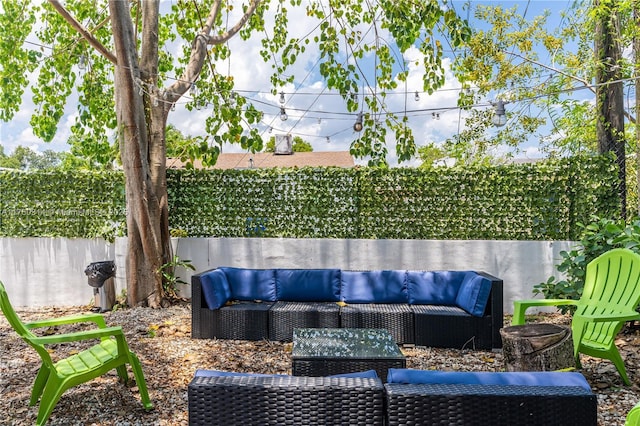 231 NW 44th St, Miami, FL 33127 - view of patio / terrace with an outdoor living space and a fenced backyard