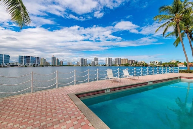 view of pool with a city view