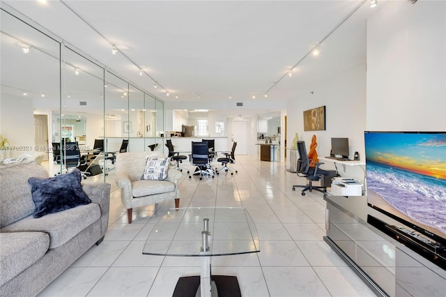 living room with light tile patterned floors and track lighting