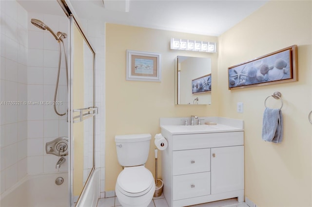 full bath featuring shower / bath combination with glass door, vanity, and toilet