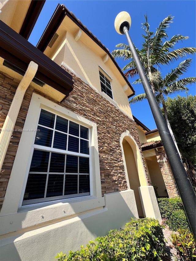 view of side of property featuring stucco siding