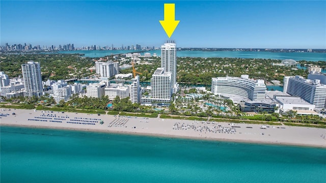 bird's eye view with a view of the beach and a water view