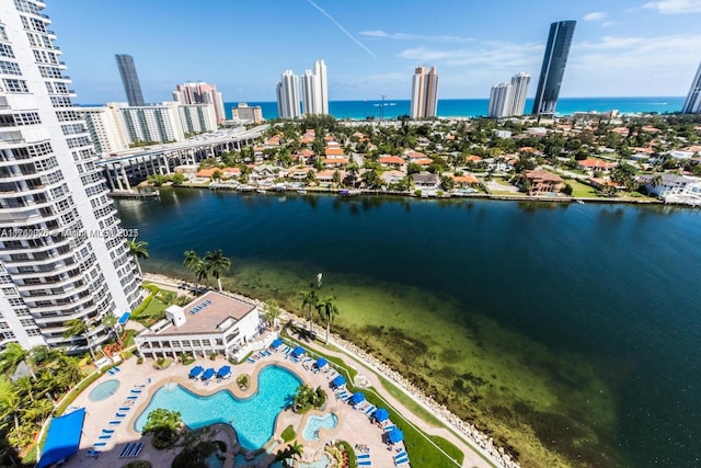 bird's eye view featuring a view of city and a water view