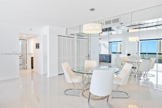 dining area featuring visible vents and baseboards