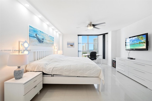 bedroom featuring light tile patterned floors and a ceiling fan