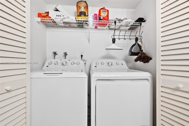 clothes washing area featuring laundry area and separate washer and dryer