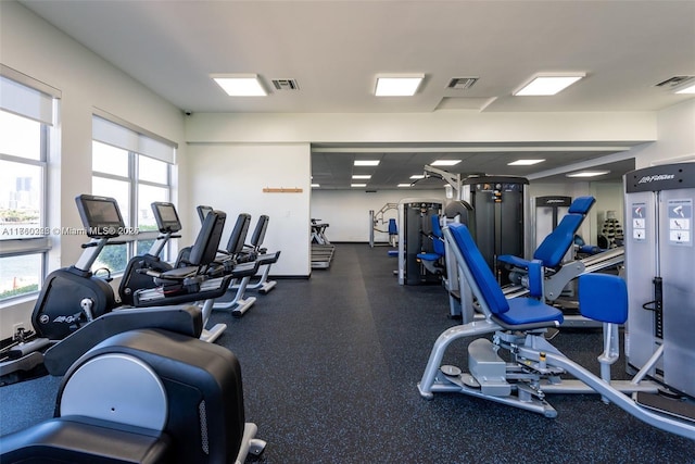 workout area featuring a healthy amount of sunlight and visible vents