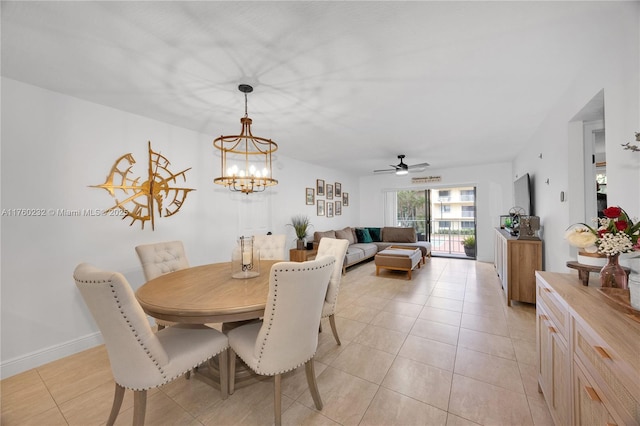 dining room featuring a notable chandelier, light tile patterned floors, and baseboards