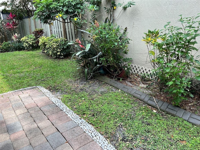 view of yard with a patio and fence