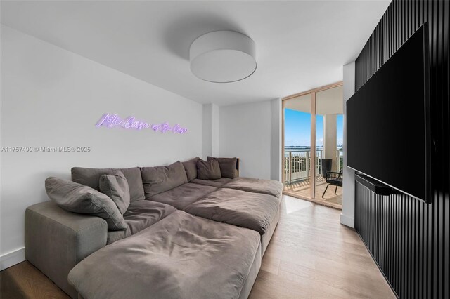 1000 Quayside Ter Unit 1812, Miami, FL 33138 - living area featuring light wood-type flooring and expansive windows