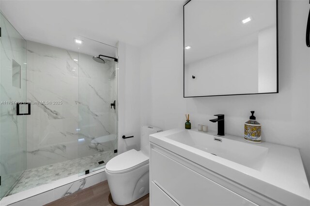 1000 Quayside Ter Unit 1812, Miami, FL 33138 - full bath featuring a marble finish shower, toilet, wood finished floors, and vanity