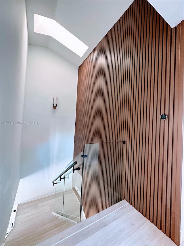 interior space featuring lofted ceiling and wood finished floors