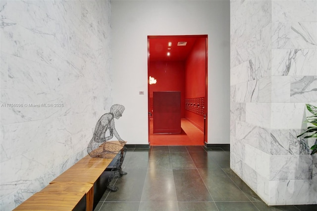 interior space featuring dark tile patterned floors