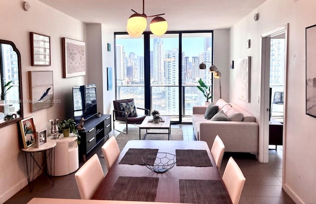 tiled dining room with floor to ceiling windows, a healthy amount of sunlight, and baseboards