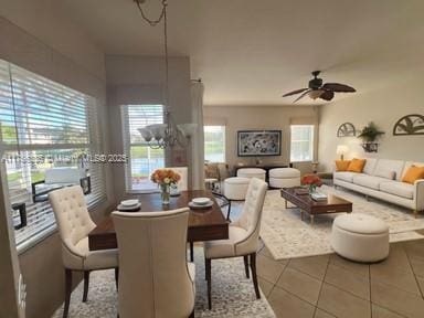 tiled dining space featuring ceiling fan