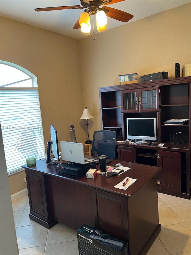 office featuring light tile patterned floors and a ceiling fan