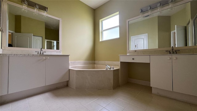 bathroom with a garden tub, two vanities, tile patterned floors, and a sink