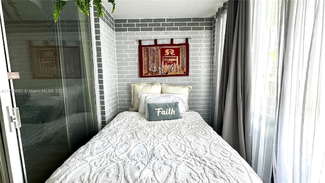 bedroom with brick wall