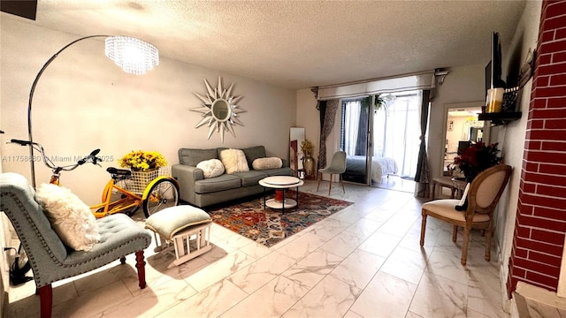 living room with marble finish floor and a textured ceiling