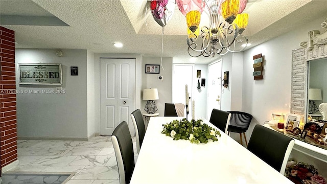 dining room featuring a textured ceiling and marble finish floor