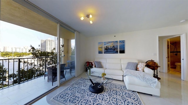 living room featuring floor to ceiling windows