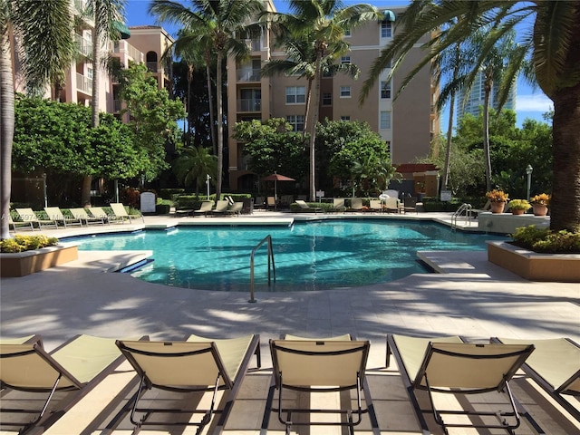 community pool with a patio area