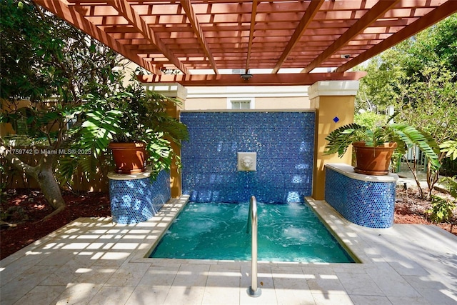 view of swimming pool featuring a pergola