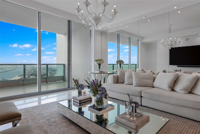 living area featuring a wall of windows, a notable chandelier, and recessed lighting