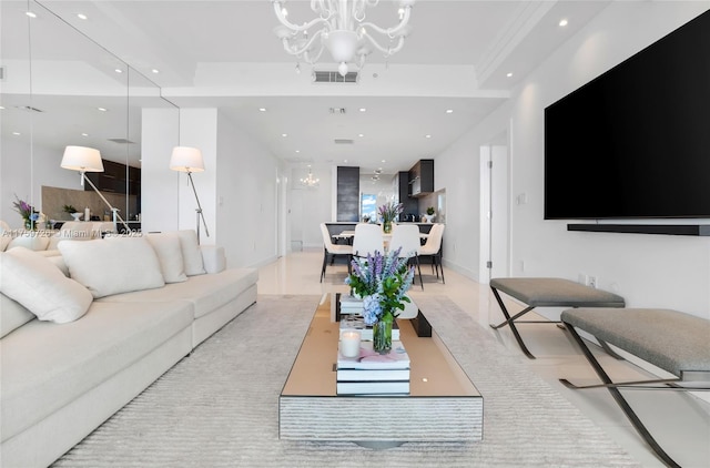 living room with a notable chandelier, recessed lighting, and visible vents