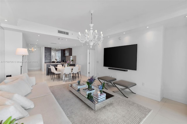 living area featuring visible vents, recessed lighting, an inviting chandelier, light tile patterned flooring, and baseboards