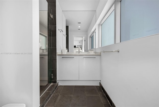 full bathroom with vanity and a shower stall