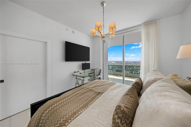 bedroom featuring a chandelier and access to exterior