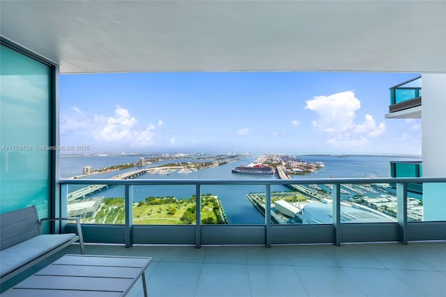 balcony featuring a water view