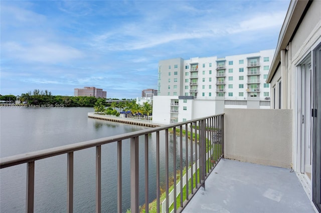 balcony with a view of city and a water view