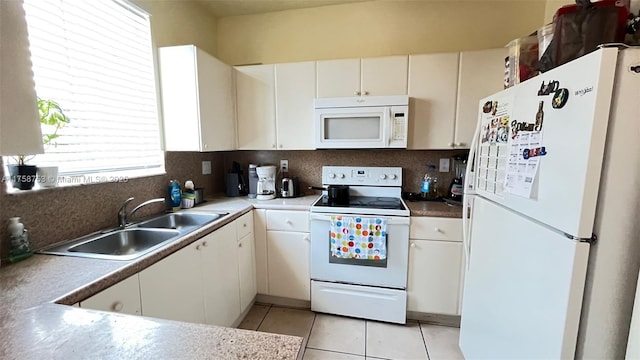 2462 SE 15th Pl Unit 339, Homestead, FL 33035 - kitchen with white appliances, tasteful backsplash, white cabinetry, and light tile patterned flooring