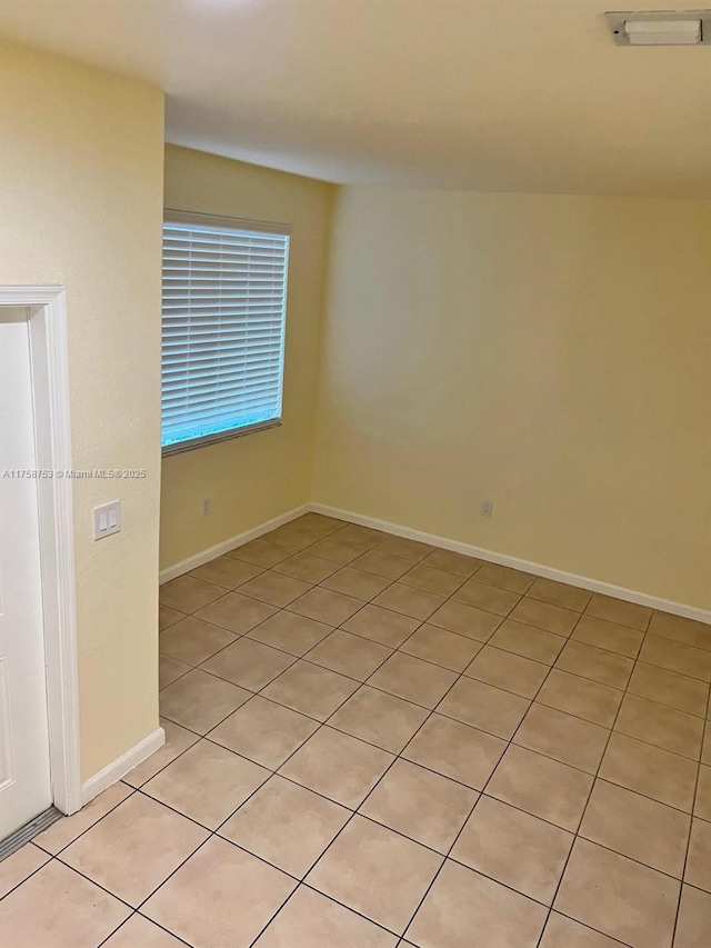 empty room with baseboards