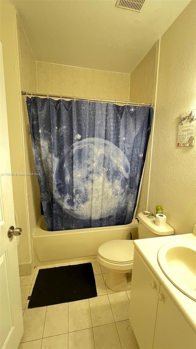 2462 SE 15th Pl Unit 339, Homestead, FL 33035 - bathroom featuring a textured wall, tile patterned flooring, shower / tub combo, vanity, and toilet