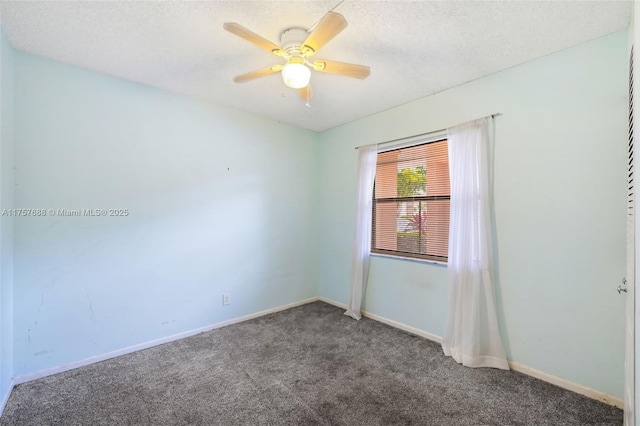 unfurnished room with a textured ceiling, a ceiling fan, baseboards, and carpet floors